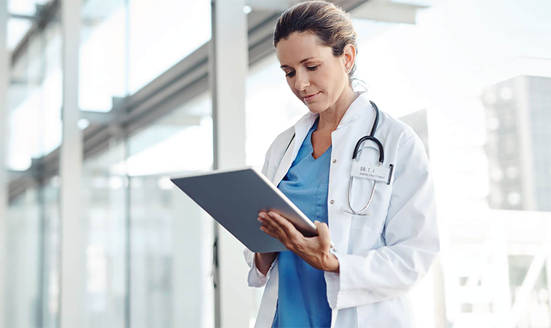 A physician on the go consults her notes